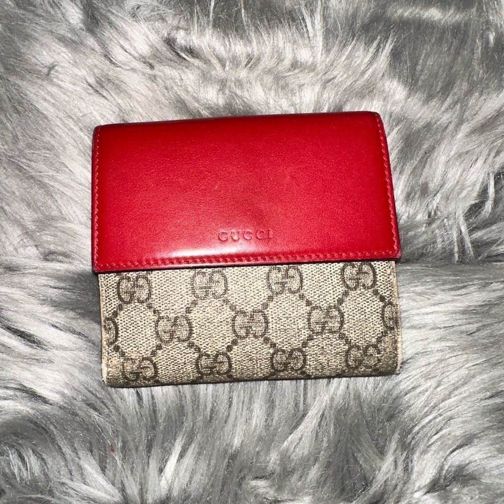 Used Gucci GG bifold wallet.